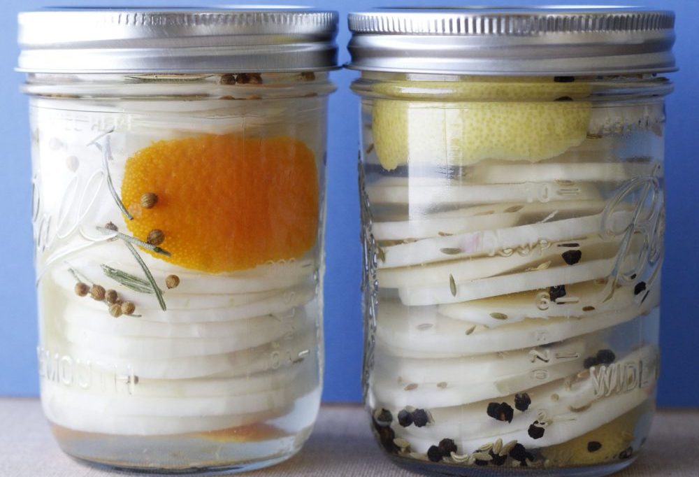 Two mason jars filled with Pickled Kohlrabi. Recipe by Meghan Feilmeier with Taproot Farm, PA.