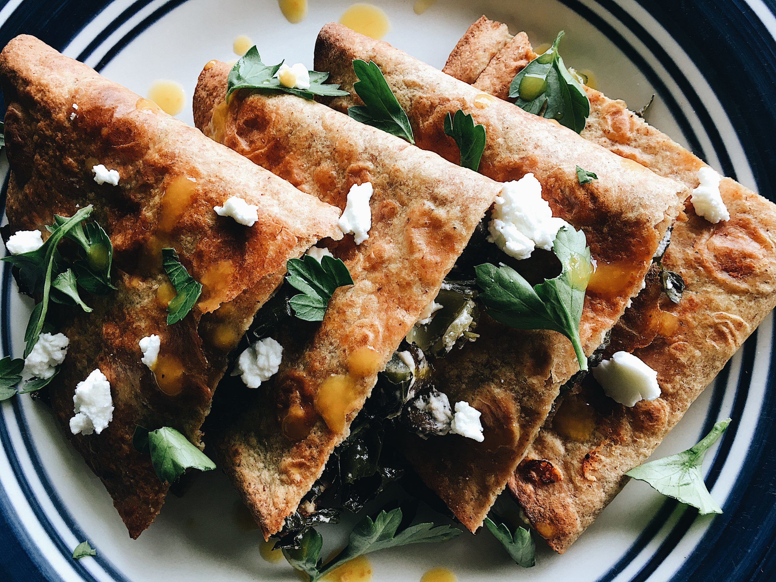 Overhead view of Kale, Mushroom and Goat Cheese Quesadillas. Recipe by Alysha Melnyk with Taproot Farm, PA.