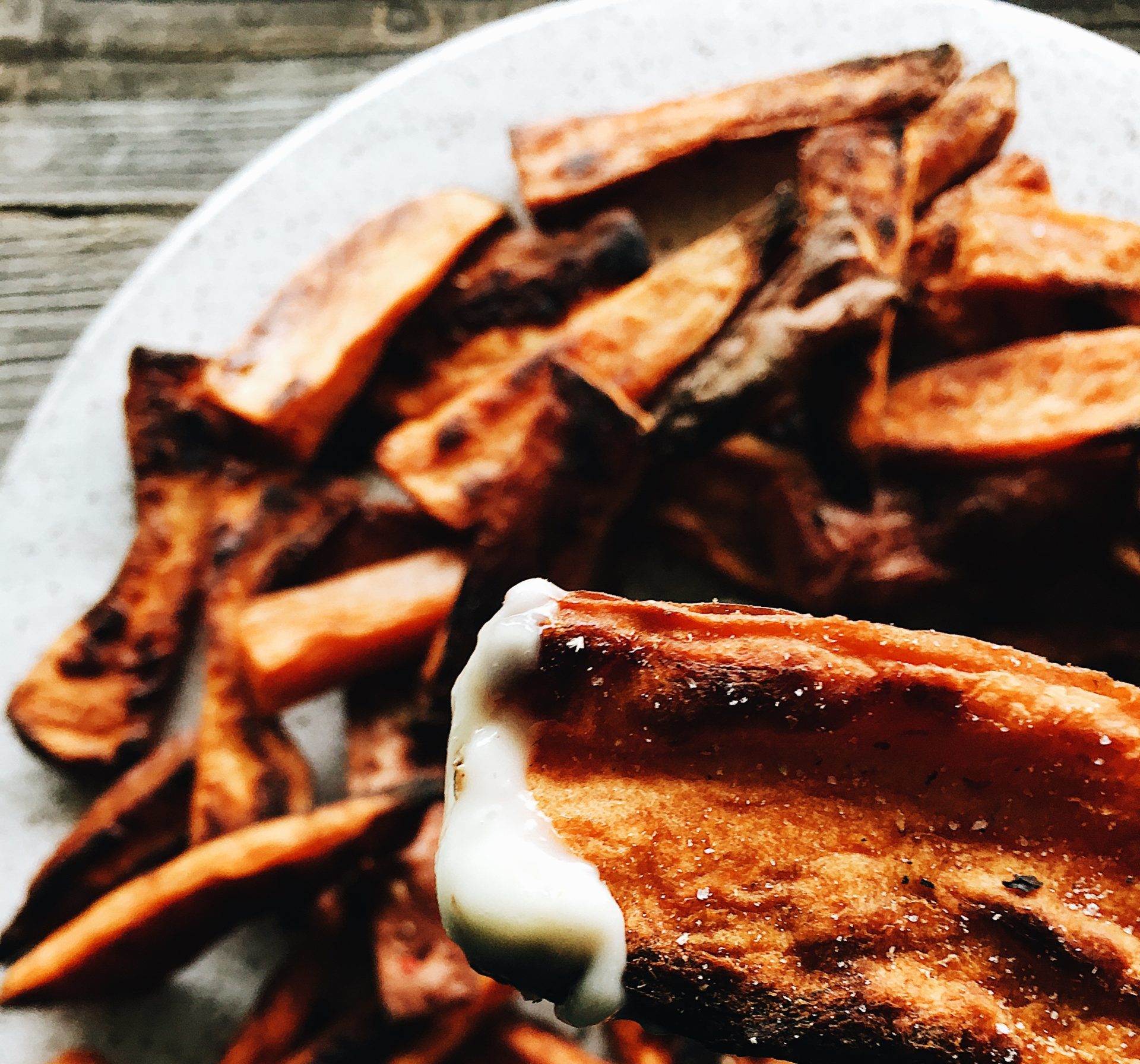 Close up shot of baked sweet potato wedges. Recipe by Alysha Melnyk with Taproot Farm, PA.