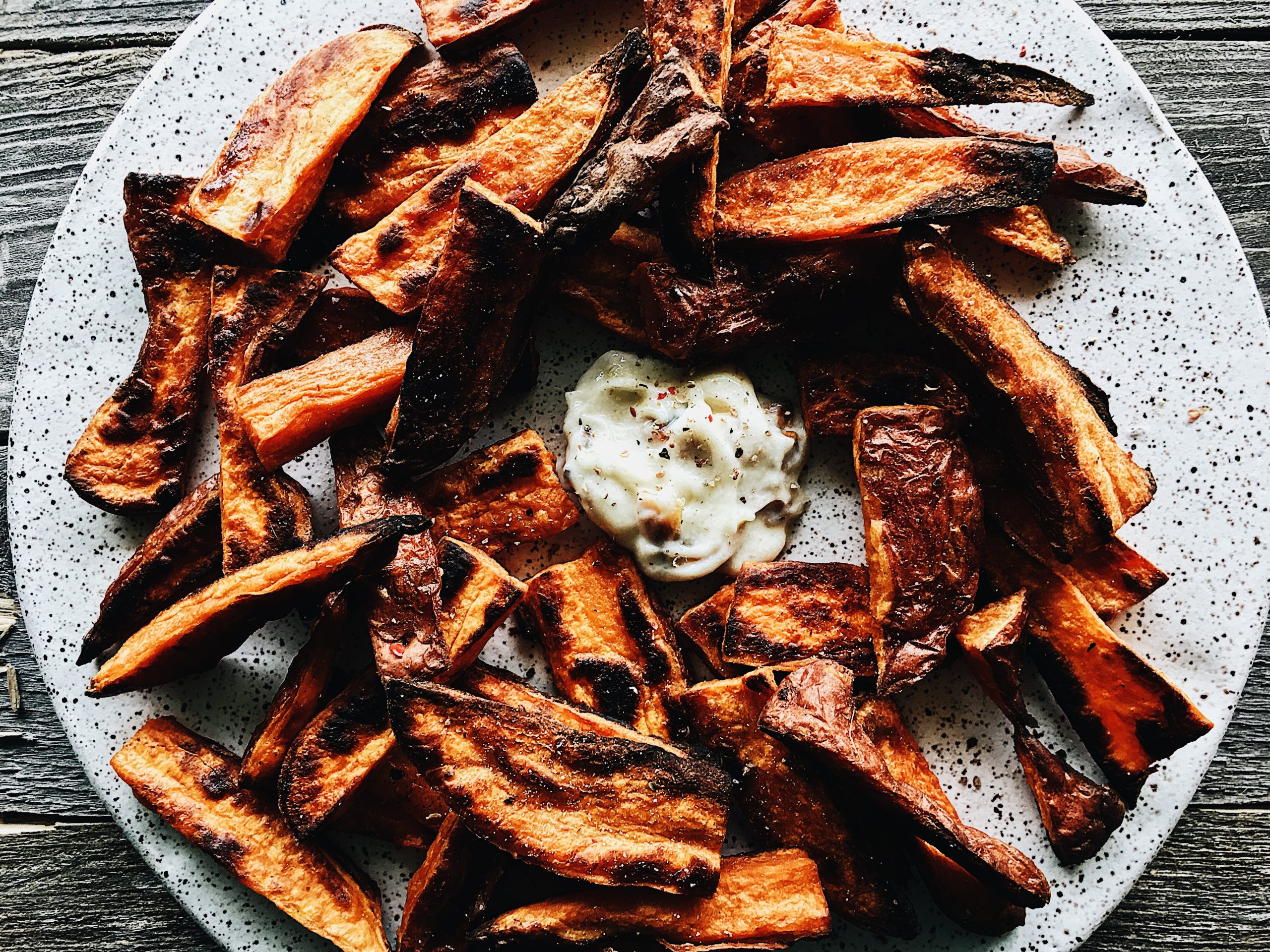 An appetizer plate of baked sweet potato wedges. Recipe by Alysha Melnyk with Taproot Farm, PA.