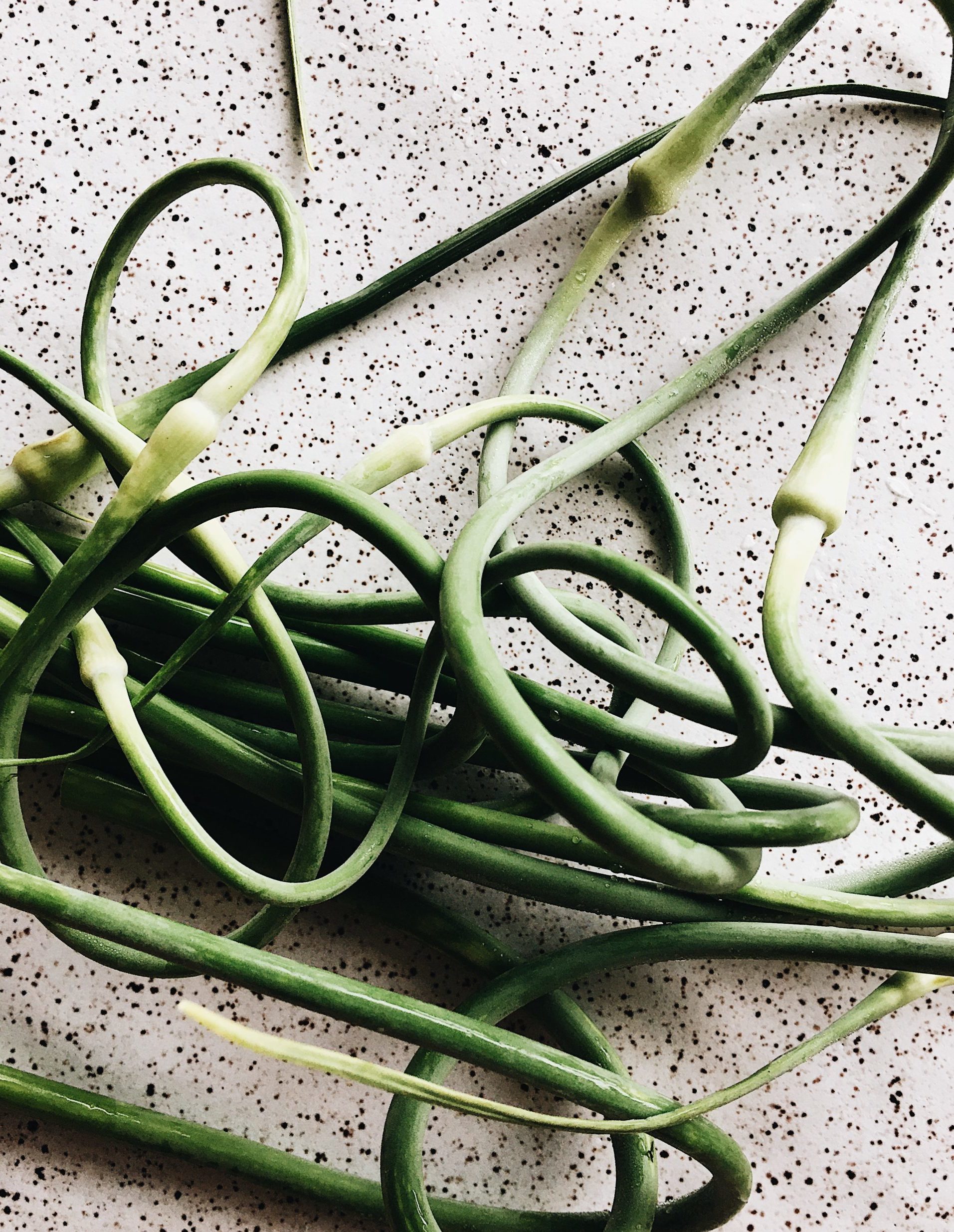Garlic scapes before trimming to cook.